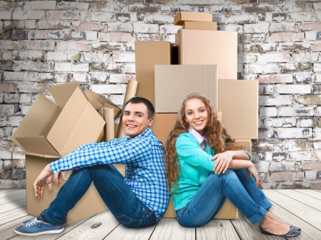Professional movers handling boxes during a Newington relocation