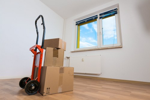 Packed boxes and furniture ready for flat removals in Newington